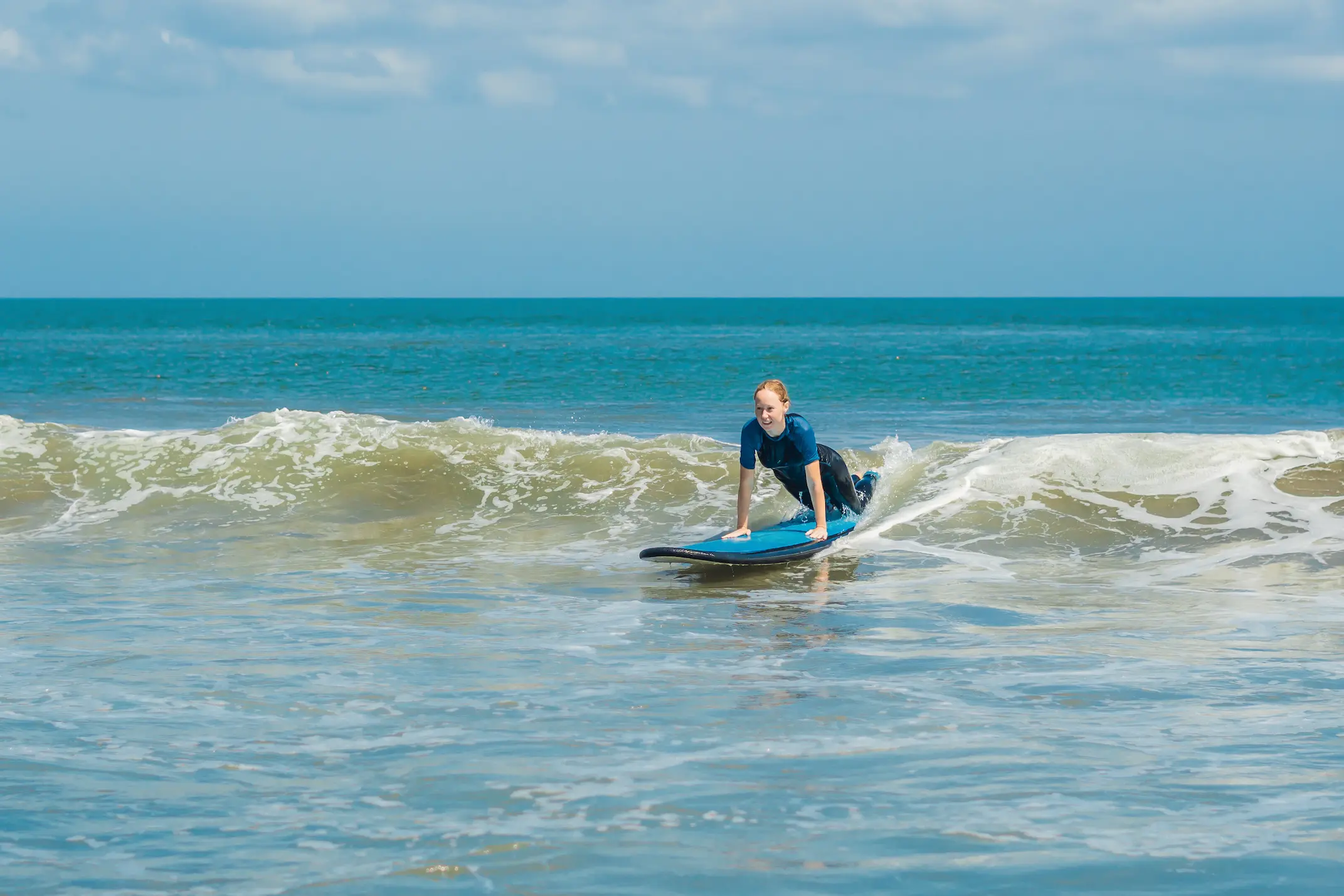Surfer catching a wave at Cocoa Beach Florida