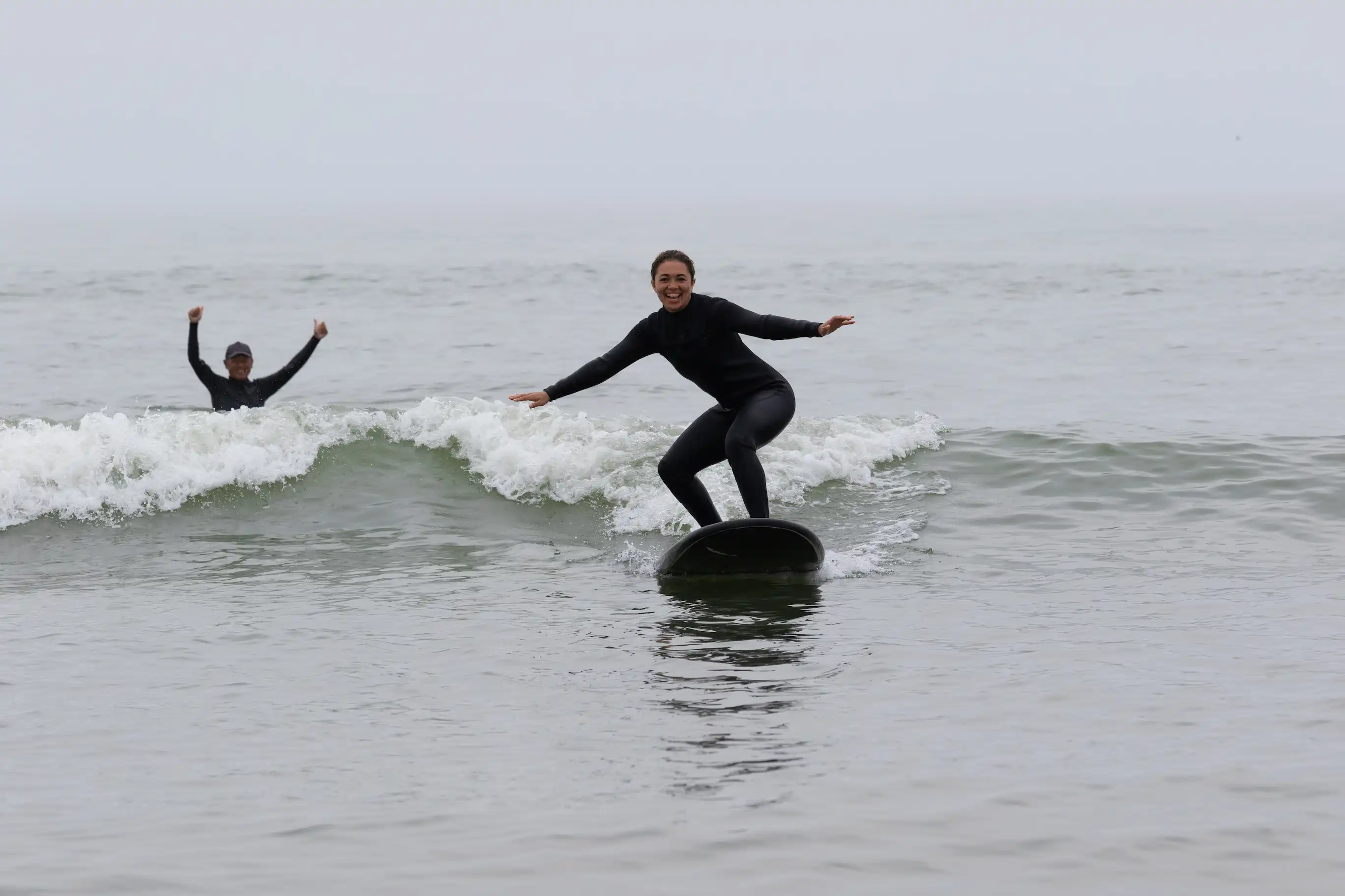 Certified surf instructor coaching a student during a private lesson in Cocoa Beach