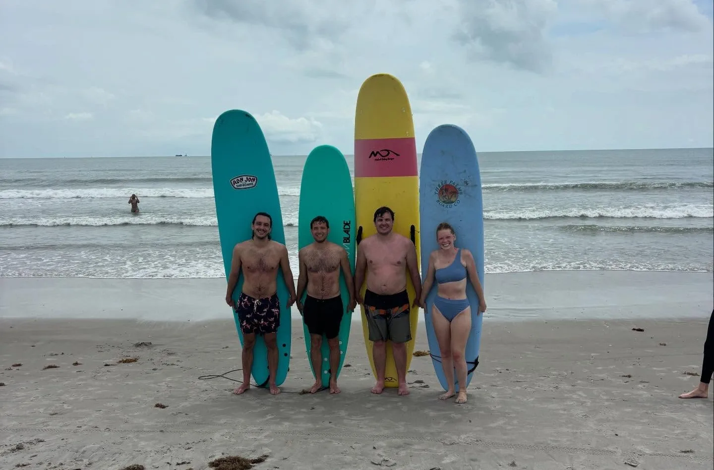 Small group of kids in a surf lesson at Cocoa Beach with certified instructor
