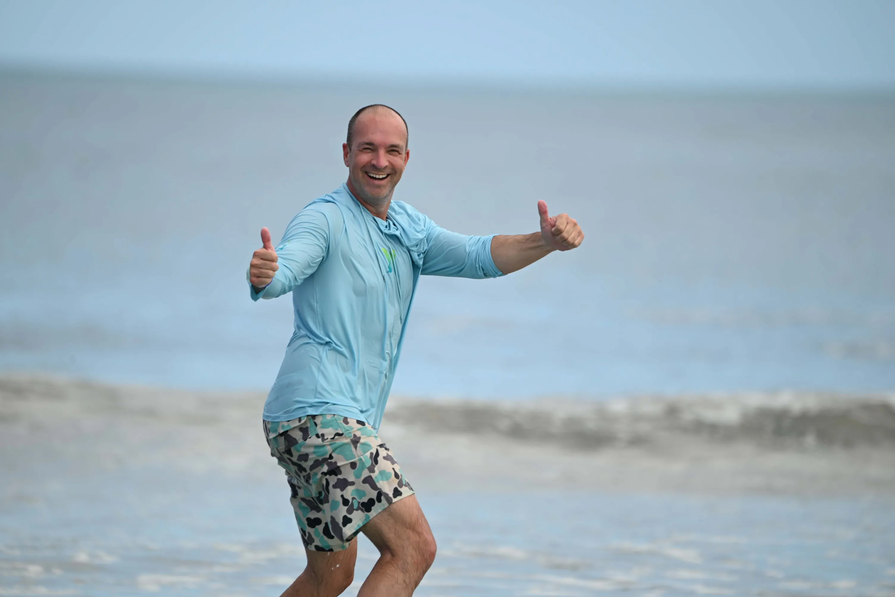 Surf coach giving wave-by-wave feedback during a coaching session in Cocoa Beach