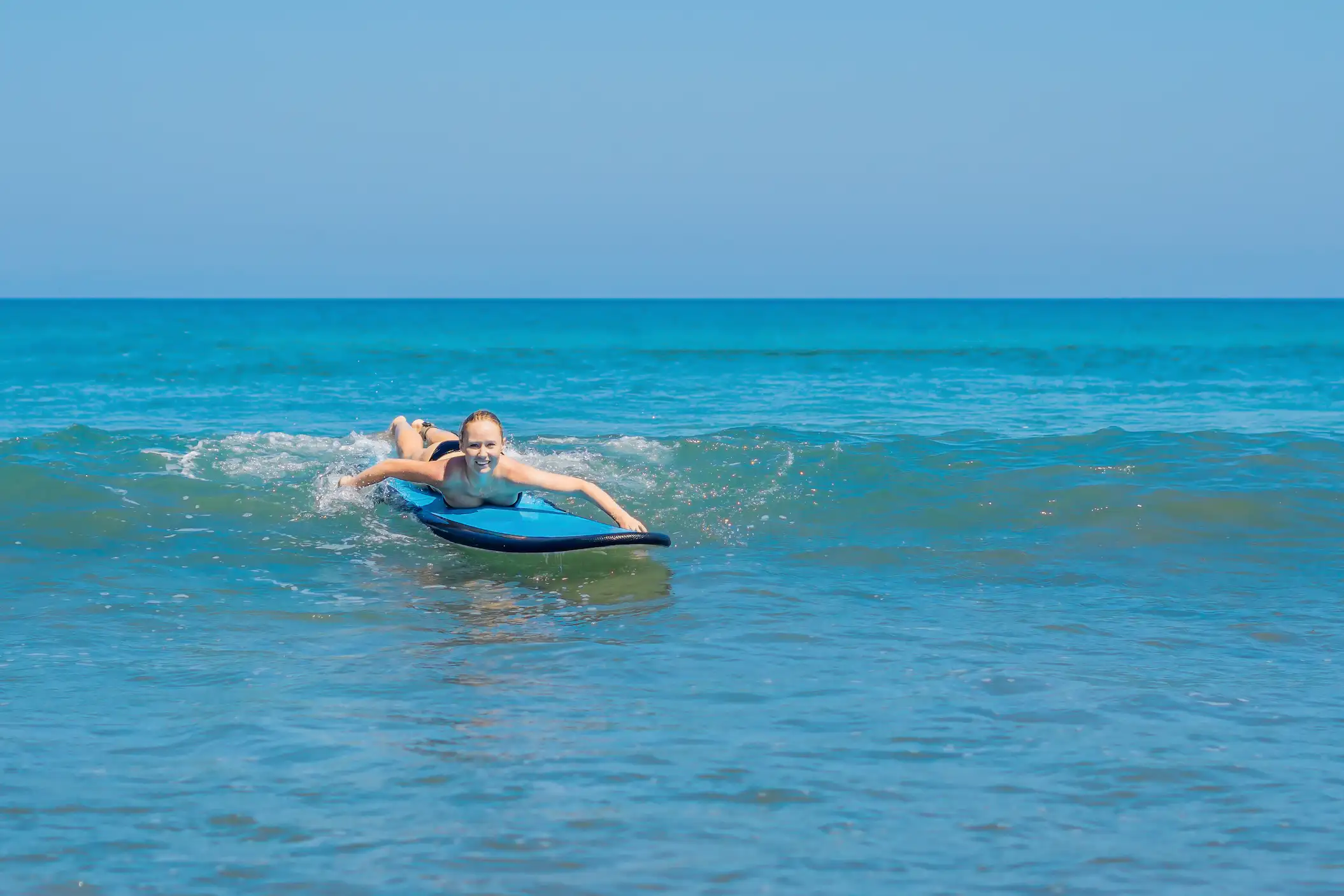 Surf coaching session at Cocoa Beach Florida — intermediate surfer getting wave-by-wave feedback
