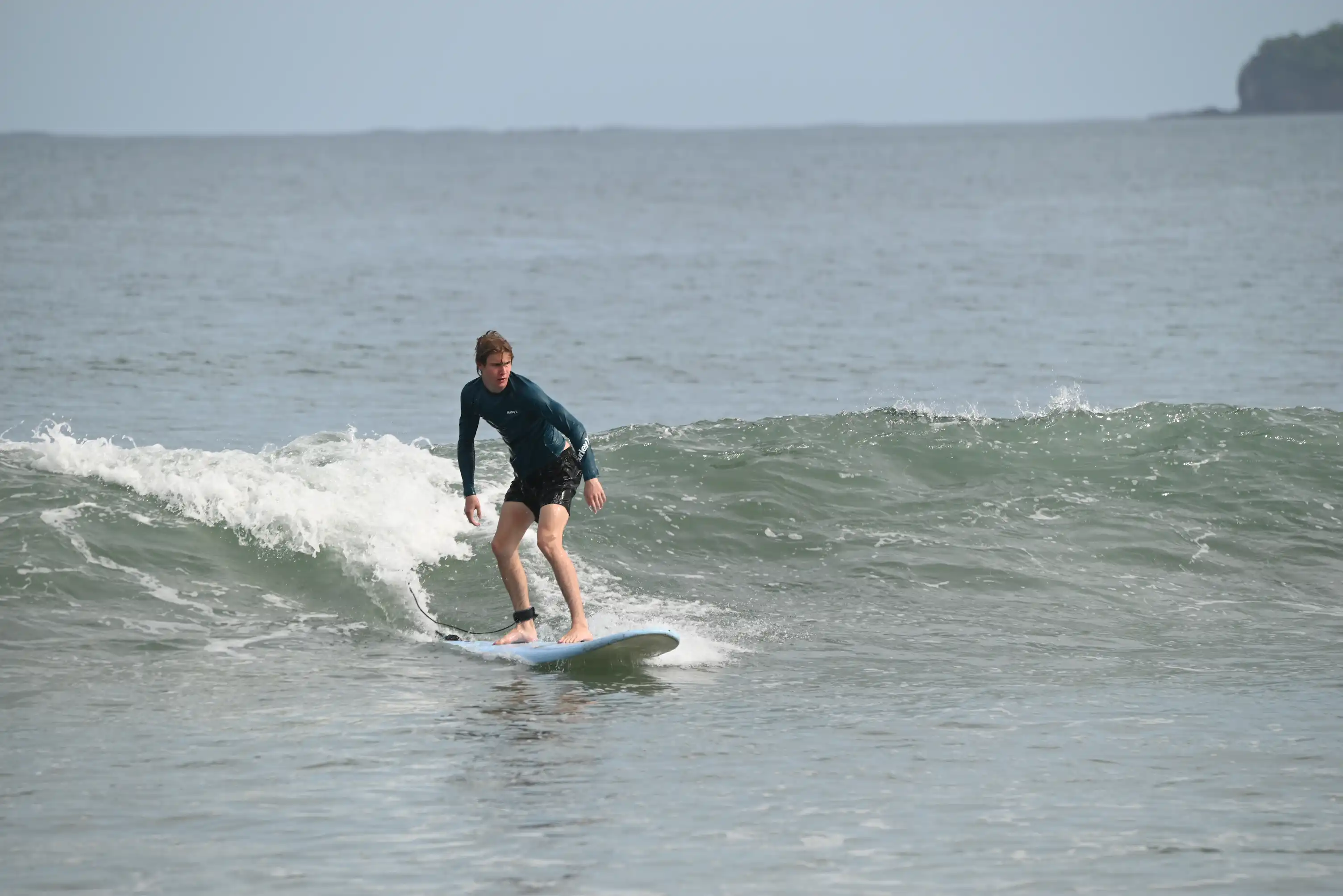 Kids surf lesson at Cocoa Beach Florida — small group with certified instructor in the water