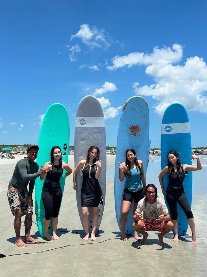 Surf lesson at Cocoa Beach Florida — instructor with students on the beach