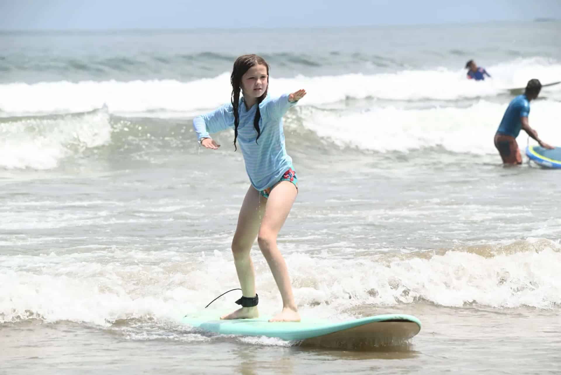 Surf instructor teaching a student at Cocoa Beach, Florida