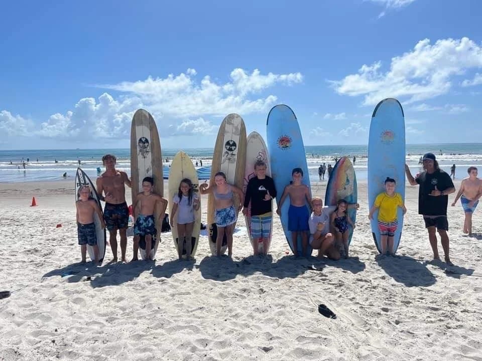 Beginner student taking surf lessons in Cocoa Beach with Cocosol Surf Lessons