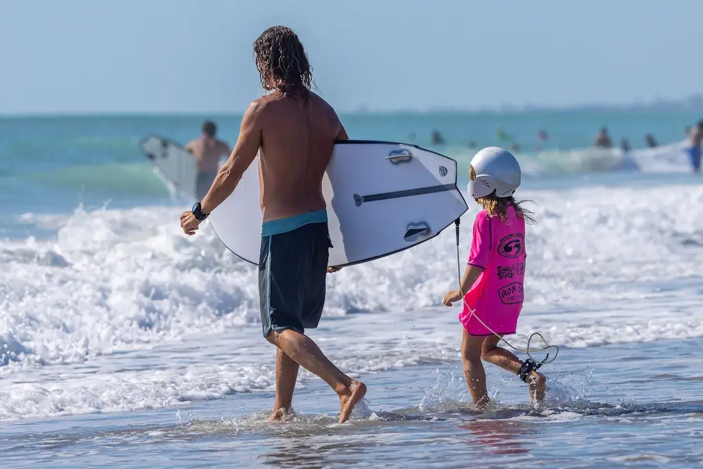 Kids surf lessons Cocoa Beach class learning ocean safety and surfing basics