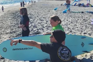 Students surfing beginner-friendly waves in Cocoa Beach Florida